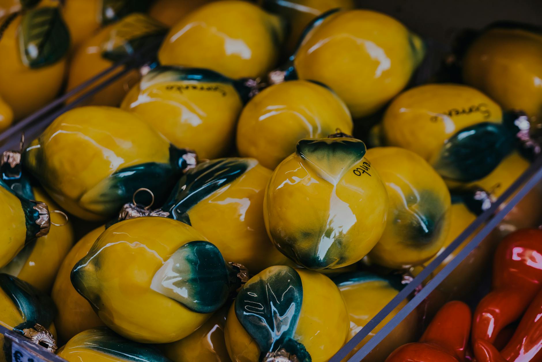 Hand holding a fresh lemon against a vibrant yellow background, symbolizing renewal and fresh starts.