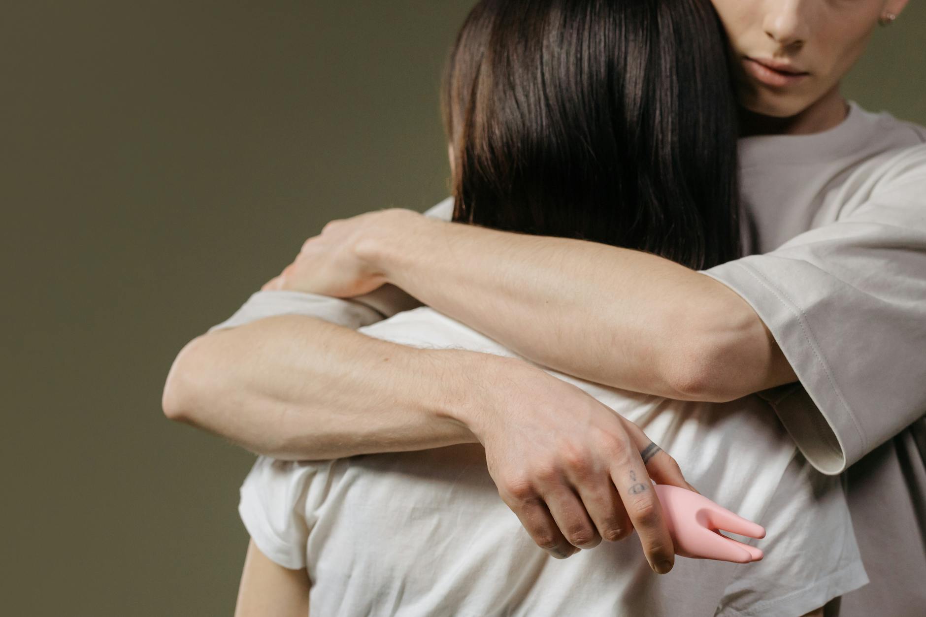 Close-up of a couple embracing, highlighting intimacy and connection across distance